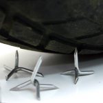 Caltrops and a car tyre